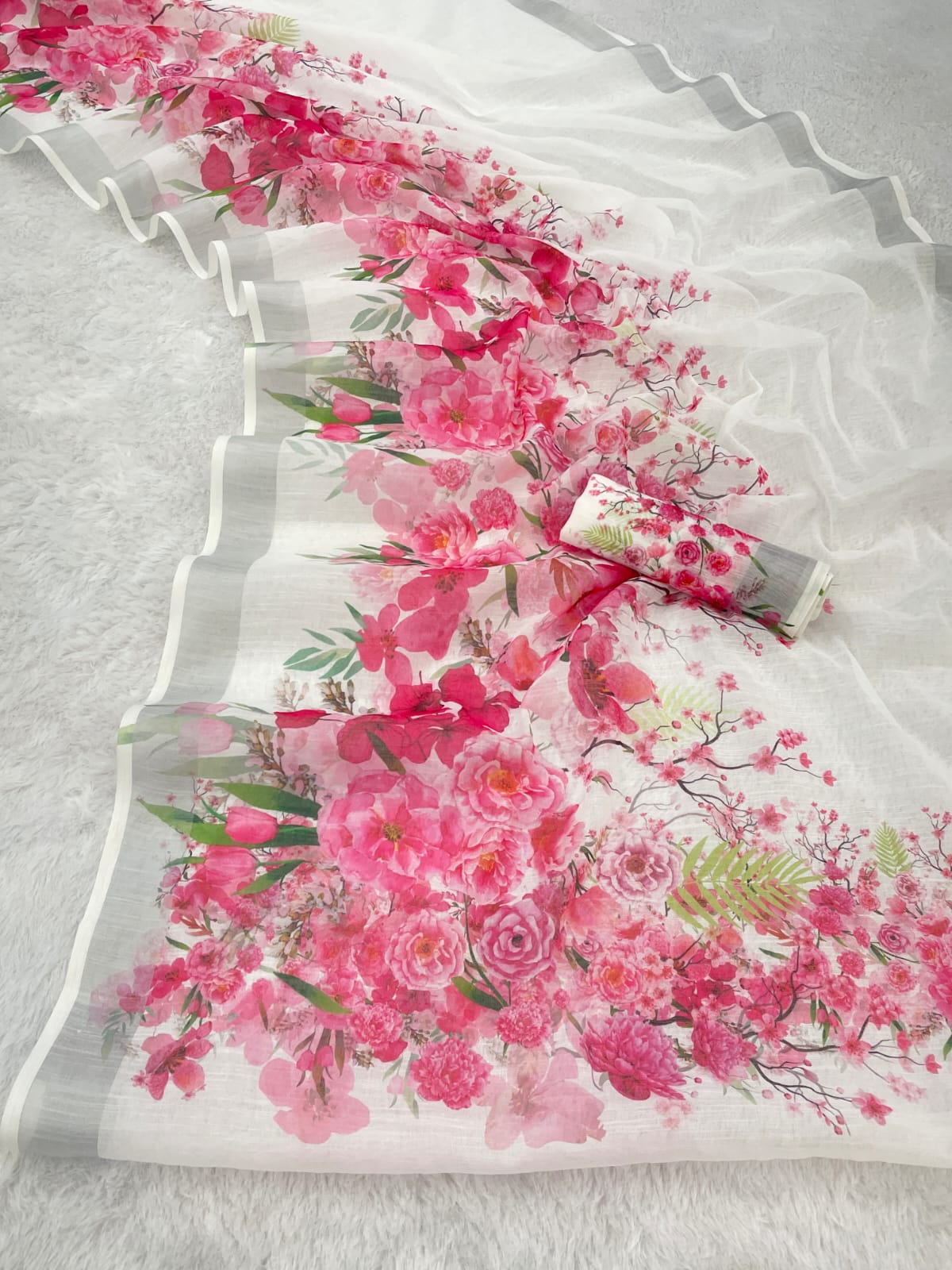 White & Pink Floral Printed Linen Cotton Saree with Zari Border & Pallu Tassels